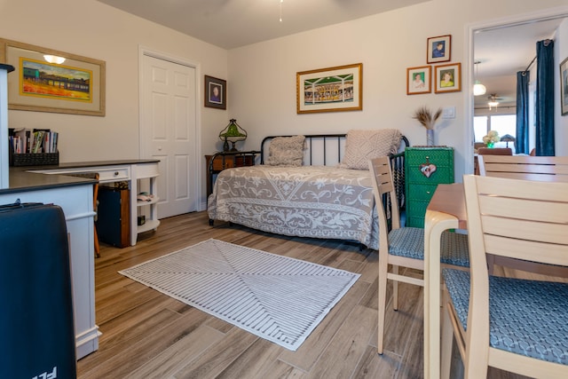 bedroom featuring hardwood / wood-style flooring and a closet