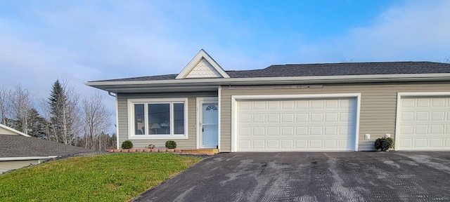 single story home with a front lawn and a garage