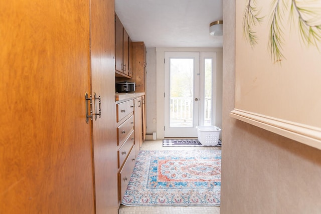 doorway to outside with a baseboard radiator