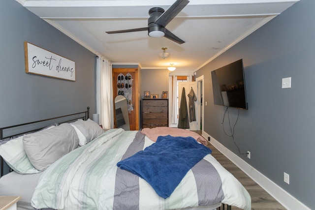 bedroom featuring ornamental molding, hardwood / wood-style flooring, and ceiling fan