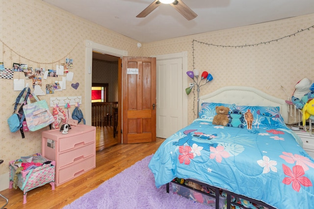 bedroom featuring ceiling fan and light hardwood / wood-style flooring