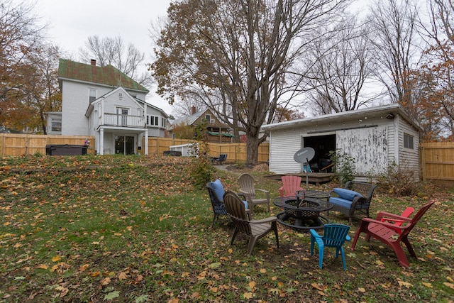 view of yard with an outdoor fire pit