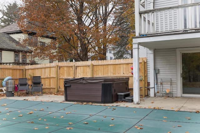 exterior space featuring a hot tub