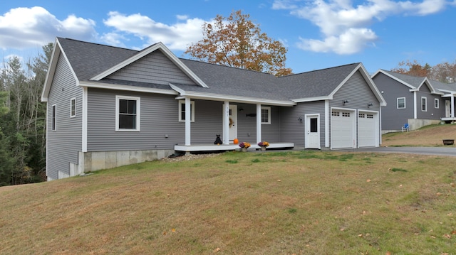 view of front of house with a front yard and a garage