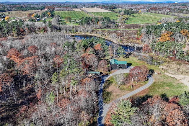 birds eye view of property featuring a water view and a rural view