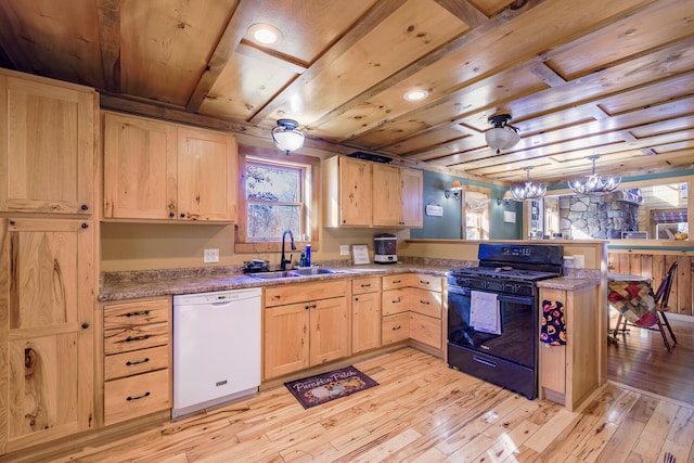 kitchen with gas stove, an inviting chandelier, dishwasher, light hardwood / wood-style floors, and sink