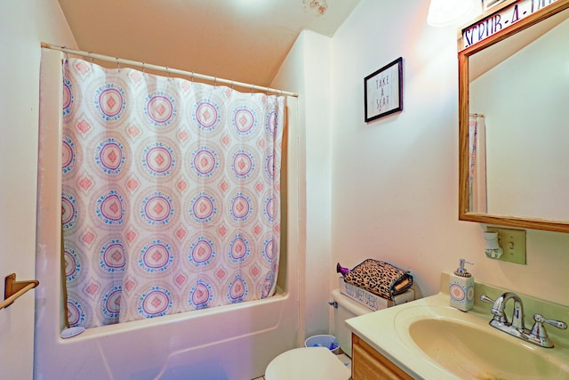 full bathroom featuring vanity, shower / tub combo with curtain, and toilet