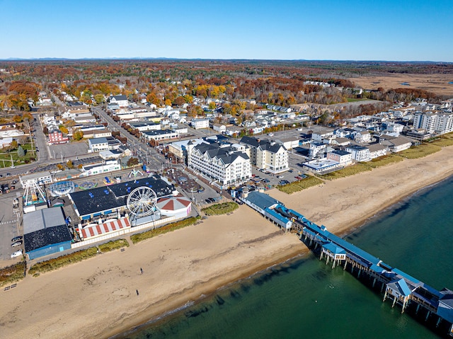 aerial view with a water view and a beach view