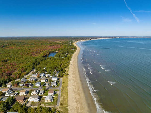 birds eye view of property featuring a water view and a view of the beach