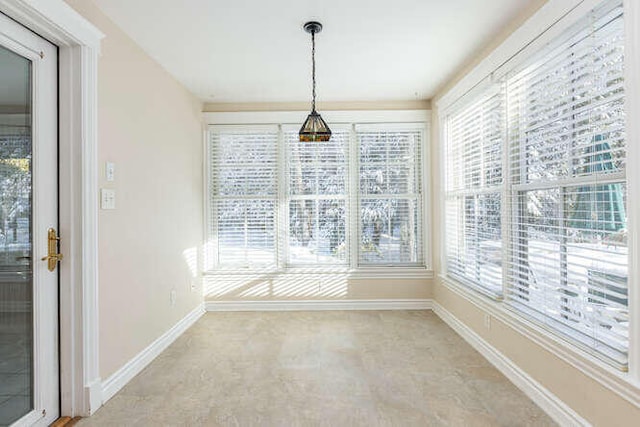 unfurnished dining area with plenty of natural light