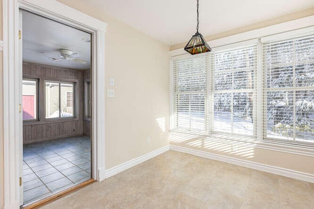 unfurnished dining area featuring plenty of natural light