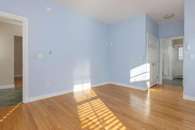 unfurnished room featuring light hardwood / wood-style floors