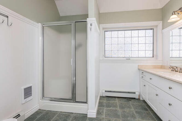 bathroom with vanity, a baseboard radiator, and walk in shower