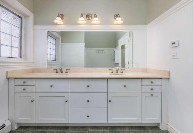 bathroom featuring vanity and a baseboard heating unit