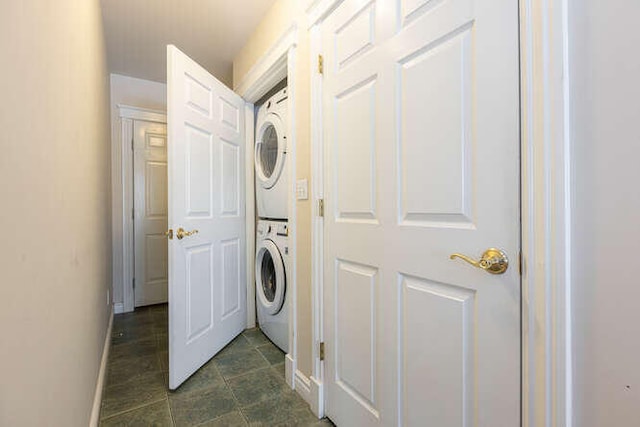 laundry area featuring stacked washer / dryer