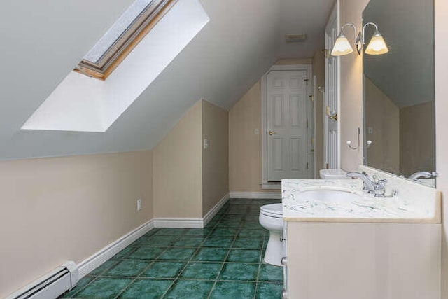 bathroom with toilet, vanity, vaulted ceiling with skylight, tile patterned flooring, and a baseboard heating unit