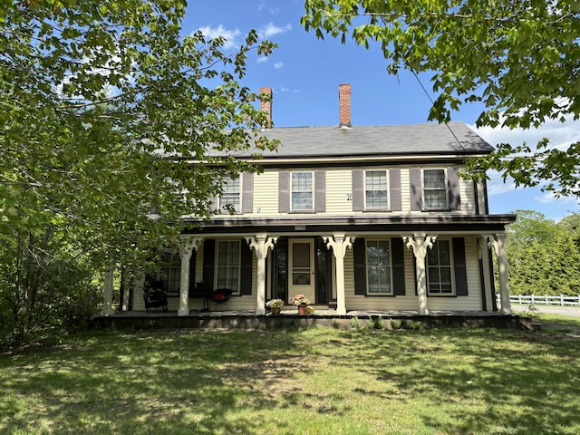 view of front of home featuring a porch and a front lawn