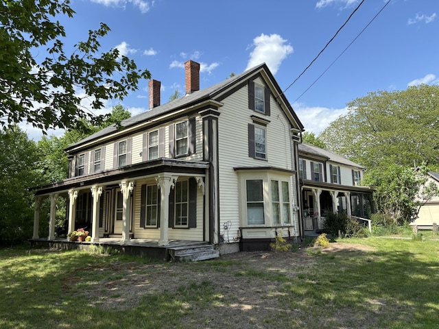 77 Fletcher St, Kennebunk, ME 04043 - back of house with covered porch, a yard, and a chimney
