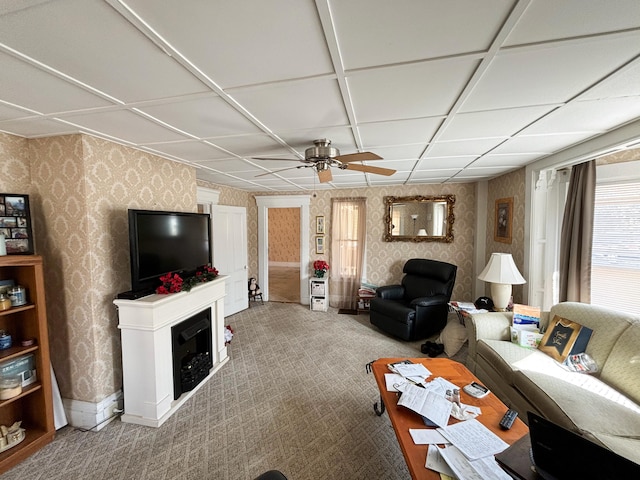 living room with coffered ceiling, carpet floors, and ceiling fan