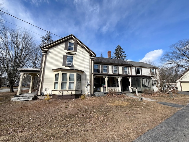 77 Fletcher St, Kennebunk, ME 04043 - traditional-style house featuring covered porch and a chimney