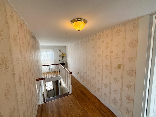 hallway with hardwood / wood-style flooring