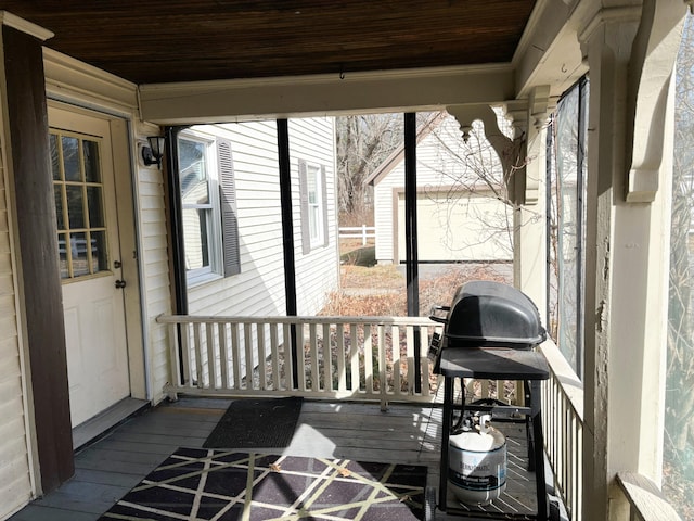 sunroom featuring wooden ceiling