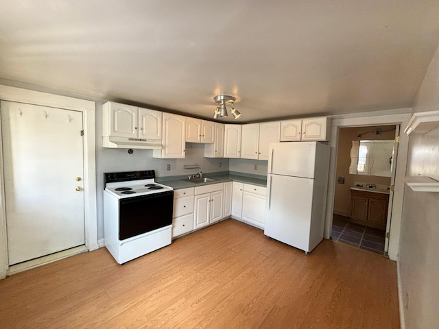 kitchen featuring white appliances, white cabinetry, sink, and light wood-type flooring