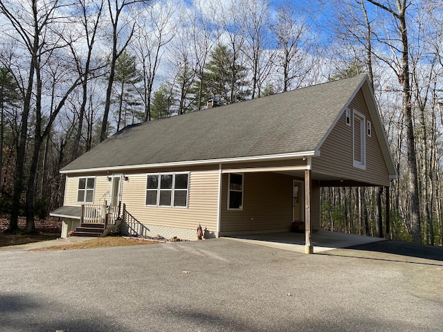 view of front of property featuring a carport