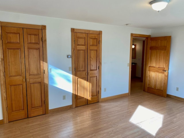 unfurnished bedroom with light hardwood / wood-style floors