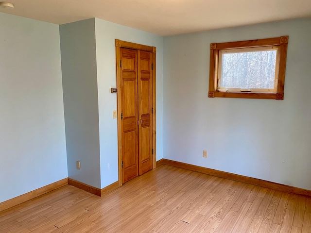 unfurnished room featuring light hardwood / wood-style floors