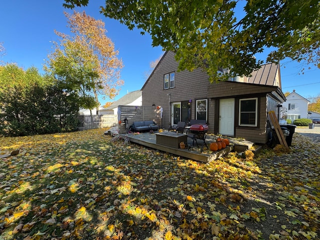 back of property featuring a wooden deck