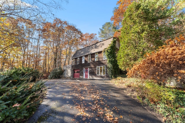 view of side of home with a garage