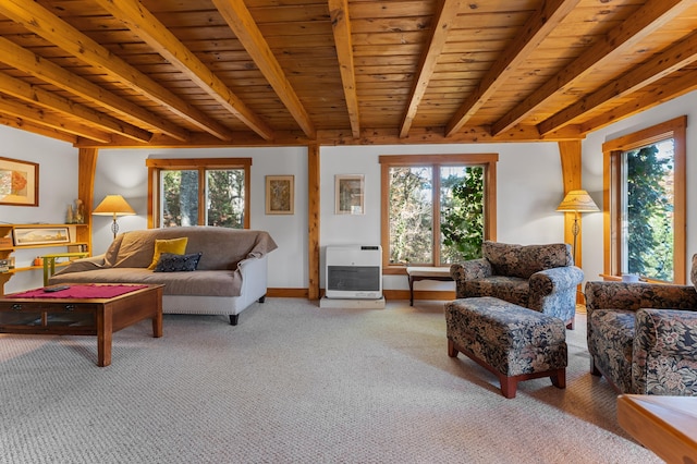 carpeted living room with wooden ceiling, beamed ceiling, heating unit, and a healthy amount of sunlight