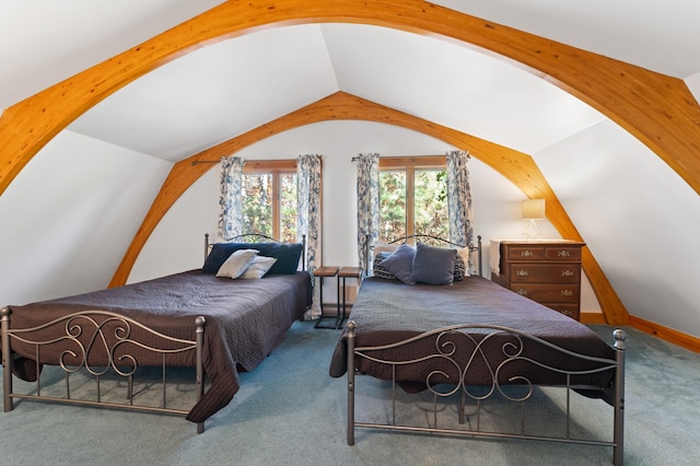 bedroom with carpet floors and lofted ceiling