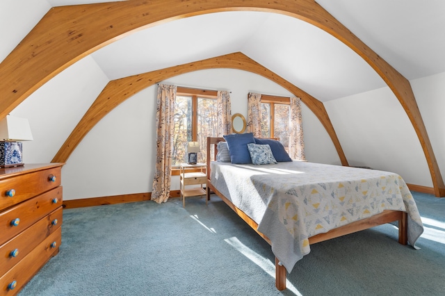 bedroom with vaulted ceiling and dark carpet