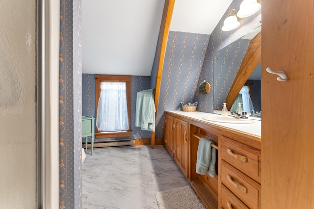 bathroom featuring a baseboard heating unit, lofted ceiling, vanity, and a shower with shower door