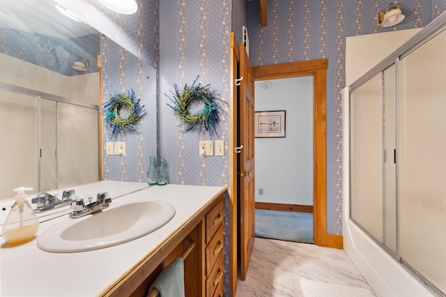 bathroom with combined bath / shower with glass door and vanity