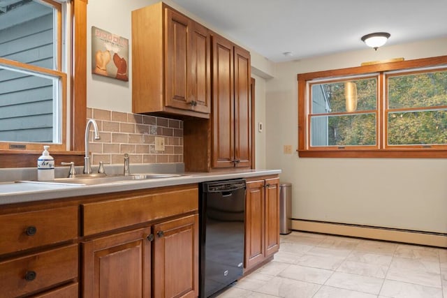 kitchen featuring backsplash, sink, light tile patterned floors, a baseboard radiator, and dishwasher