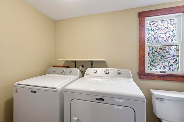 laundry room featuring washing machine and clothes dryer