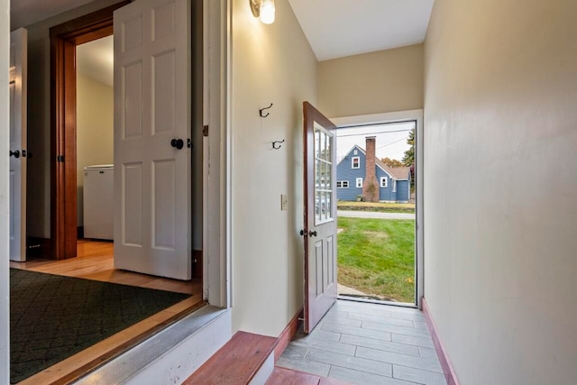 doorway to outside featuring light wood-type flooring