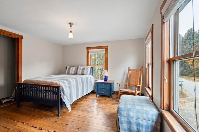 bedroom with light wood-type flooring