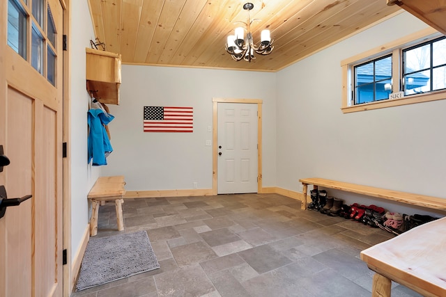 mudroom featuring wood ceiling, crown molding, and an inviting chandelier