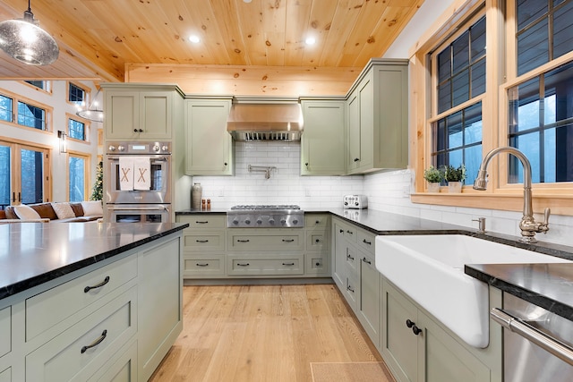 kitchen with wood ceiling, hanging light fixtures, backsplash, appliances with stainless steel finishes, and light wood-type flooring