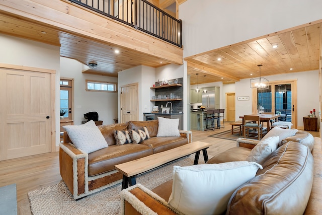 living room with wood ceiling and light wood-type flooring