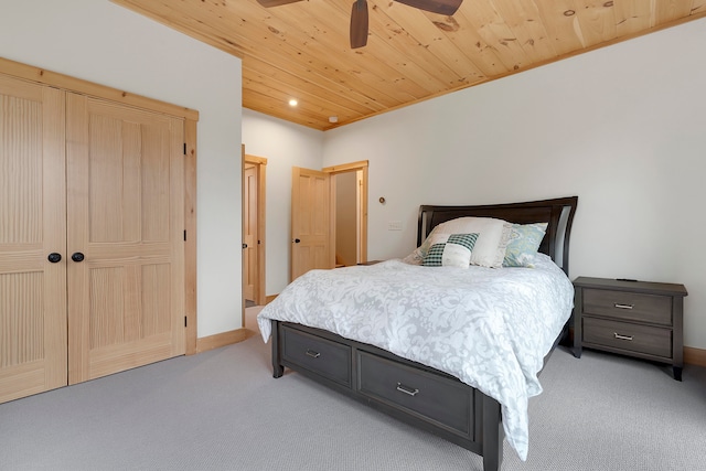 carpeted bedroom with ceiling fan and wood ceiling