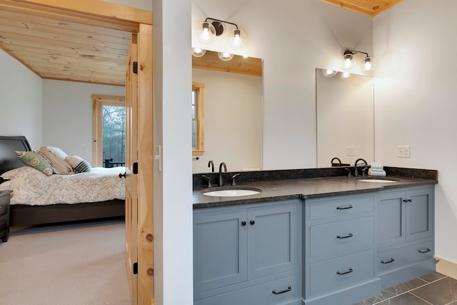 bathroom featuring vanity, wooden ceiling, and vaulted ceiling