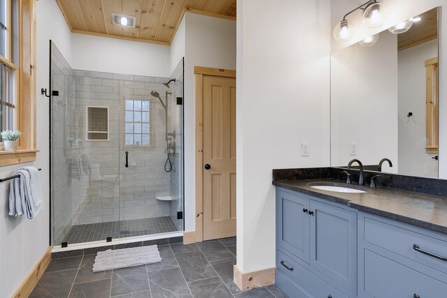 100 Morganite Way, Newry, ME 04261 - full bathroom featuring a shower stall, vanity, baseboards, marble look tile flooring, and wood ceiling