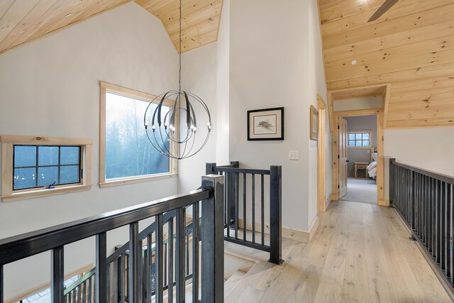 100 Morganite Way, Newry, ME 04261 - hallway featuring wooden ceiling, an upstairs landing, a chandelier, high vaulted ceiling, and light wood-style floors