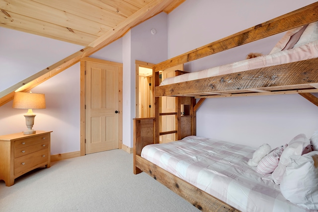 bedroom with lofted ceiling and light colored carpet