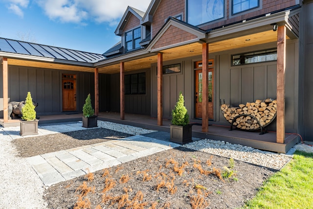 doorway to property featuring covered porch